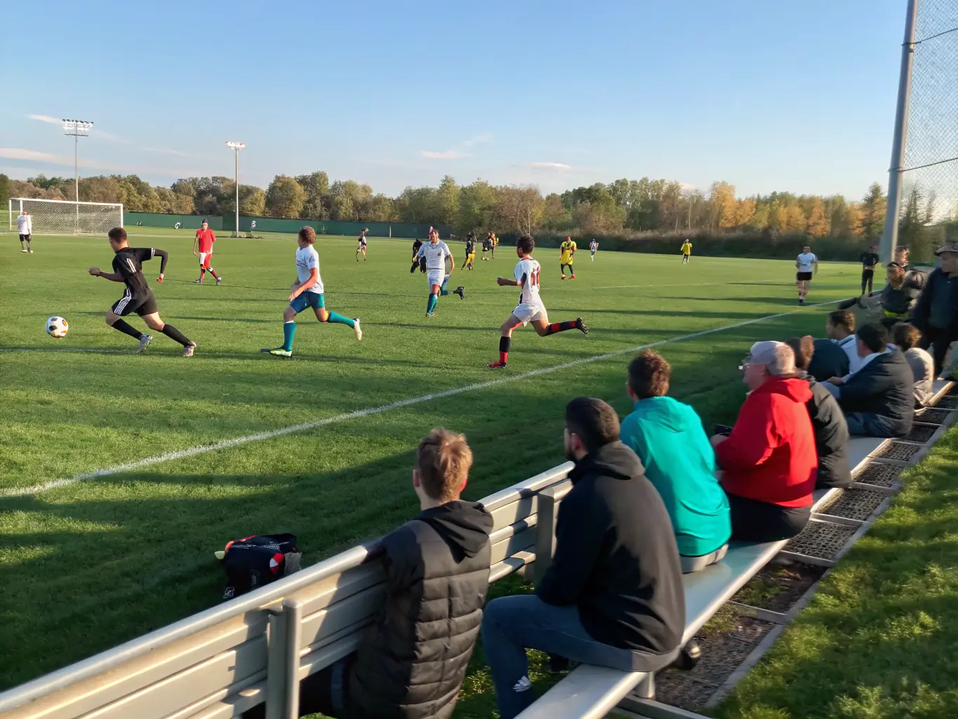An image of community members participating in a recreational sports activity, such as a friendly soccer match or a group fitness class, emphasizing the recreational opportunities at RCF.